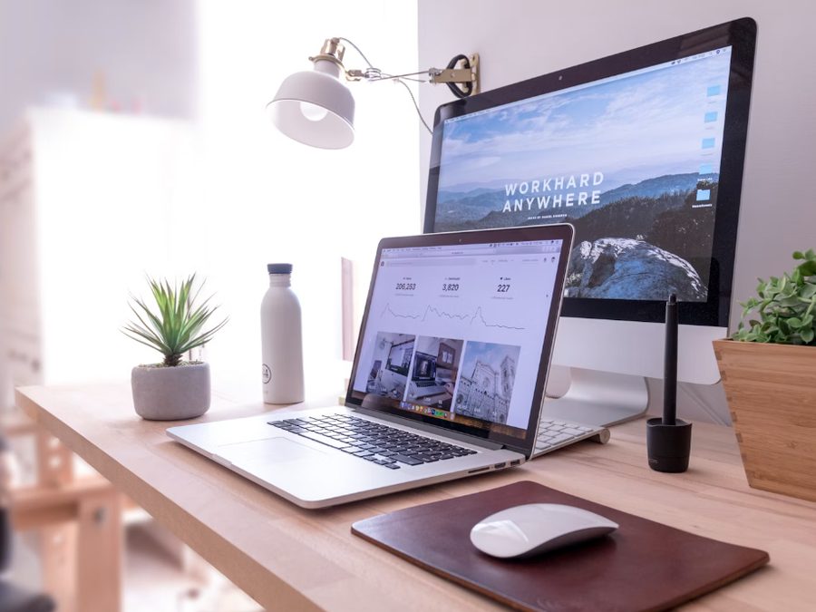Laptop and monitor showing a website — electronic sites and digital platforms